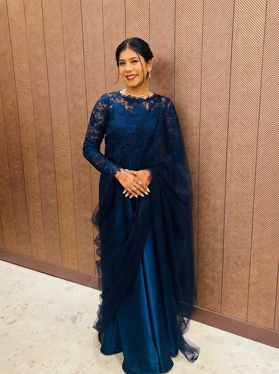Model in navy lace couture gown